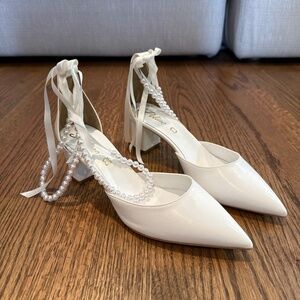 White leather and pearl wedding shoes
